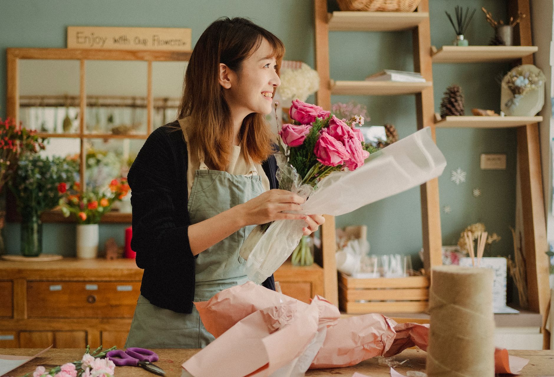 Florist arranging a bouquet at Hollis & Vine, Ottawa
